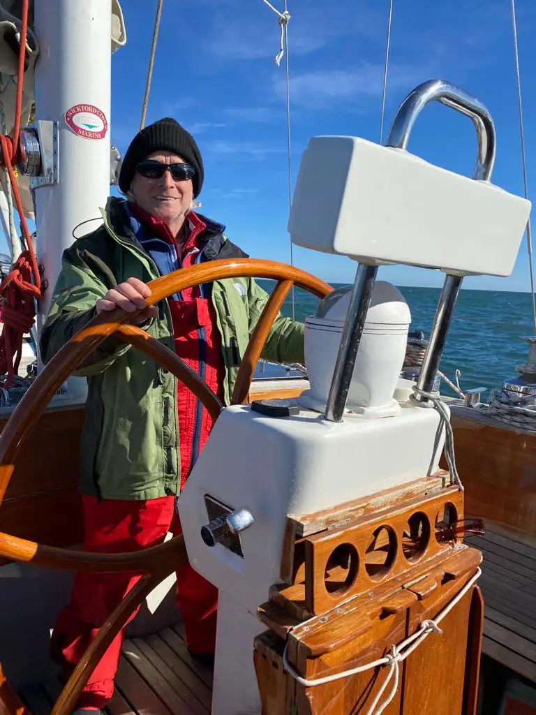 At the helm of a yacht